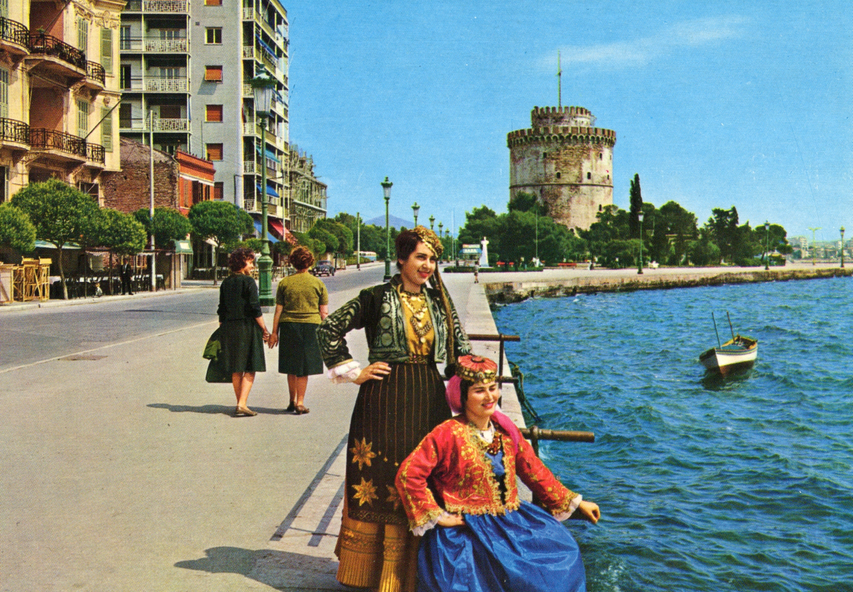 Young women on Thessaloniki's old quay, dressed in the traditional Amalia costume artifact